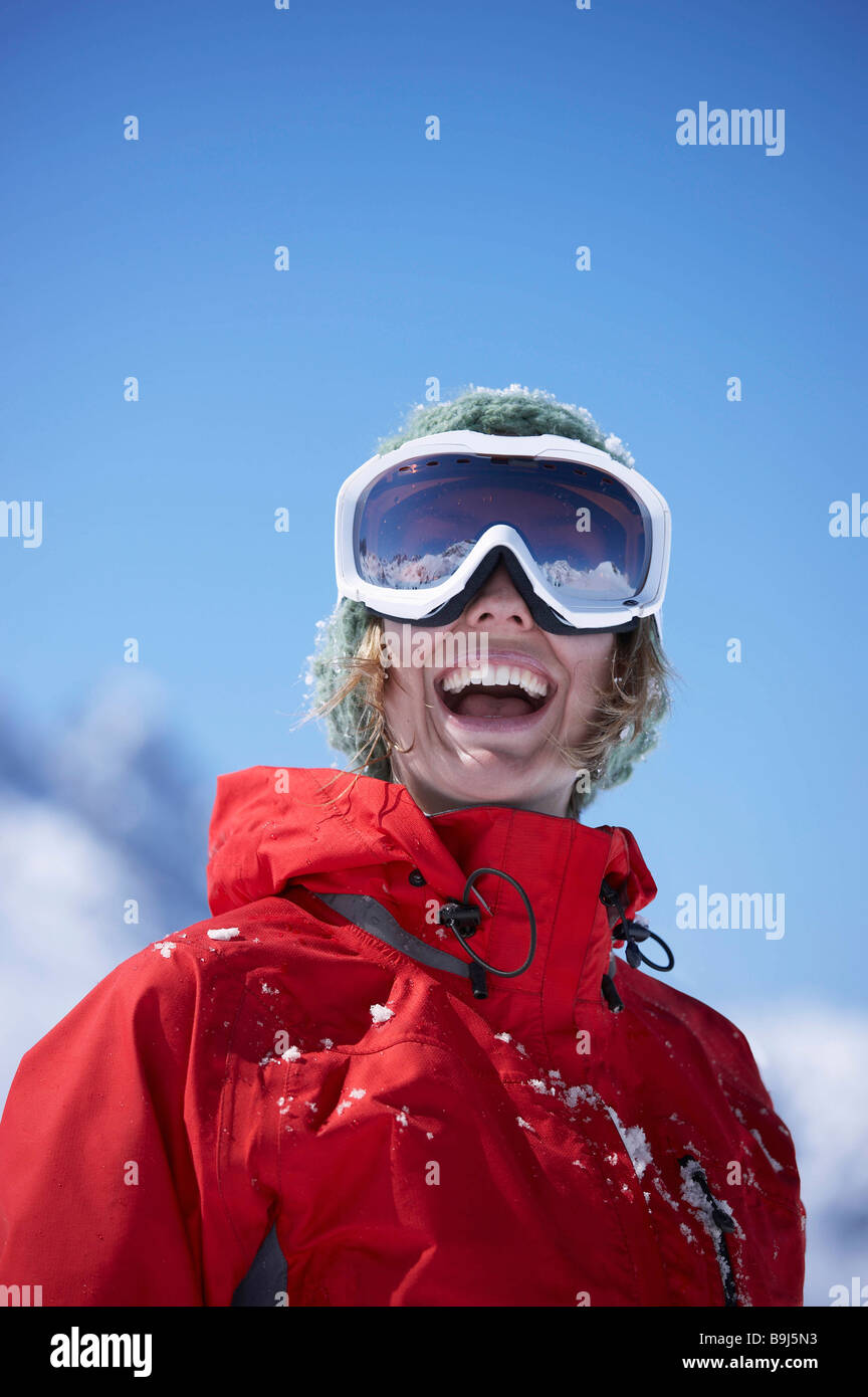 Young woman wearing ski goggles Stock Photo - Alamy