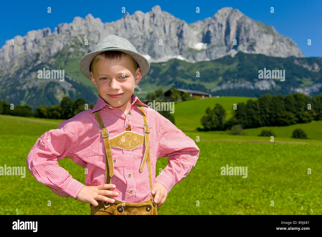 Boy, six years, in traditional attire, at the back the Wilder Kaiser mountain range, Tirol, Austria, Europe Stock Photo