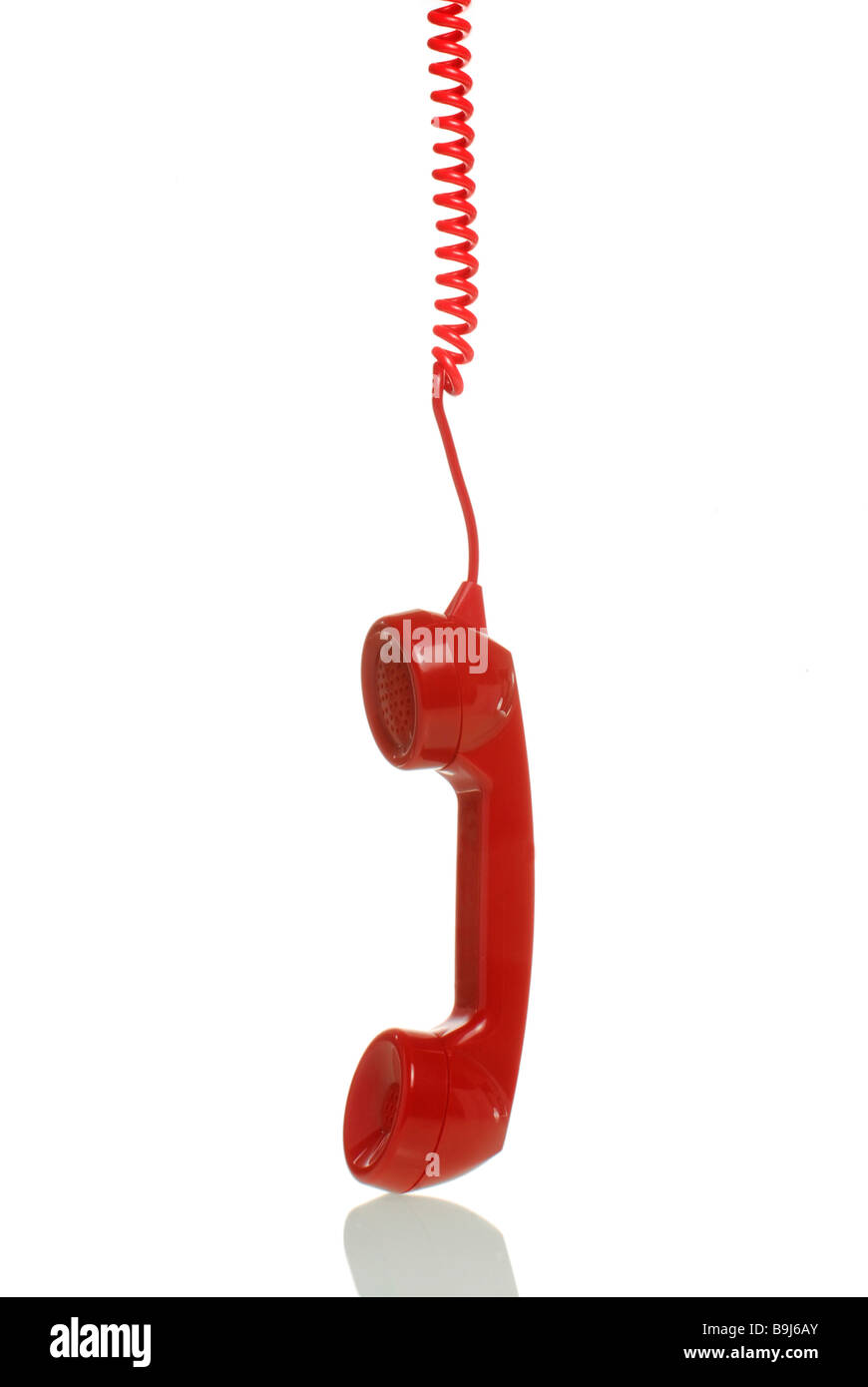 Red telephone receiver hanging down Stock Photo