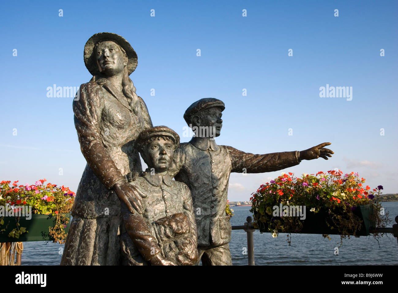 The bronze statue of Annie Moore and her two brothers outside the Cobh