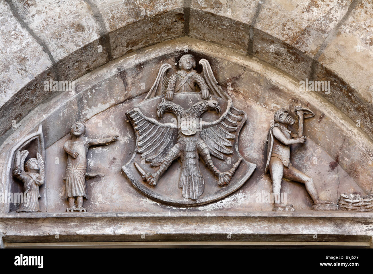 Tympanum with miner and double-headed eagle, Oswaldikirche Church, Eisenerz, Styria, Austria, Europe Stock Photo