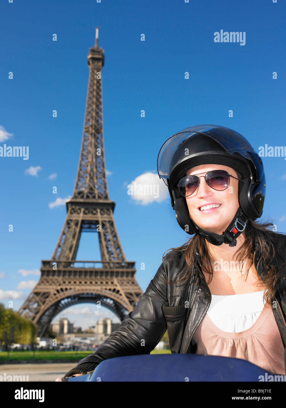 Woman on moped in Paris Stock Photo Alamy