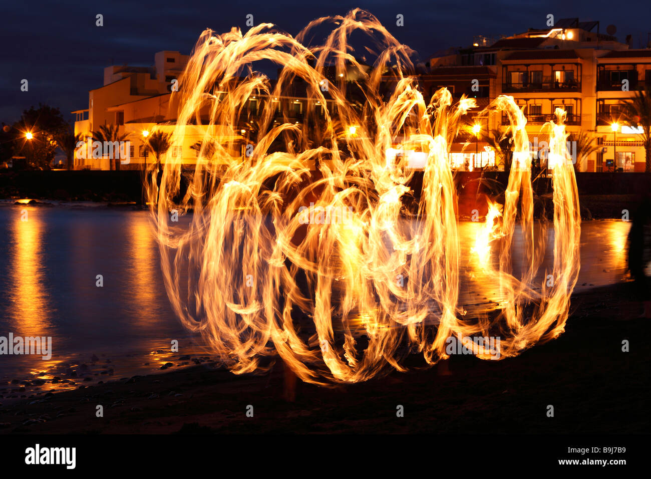 Light trails of torchlight dancer in La Playa, Valle Gran Rey, La Gomera, Canaries, Canary Islands, Spain, Europe Stock Photo