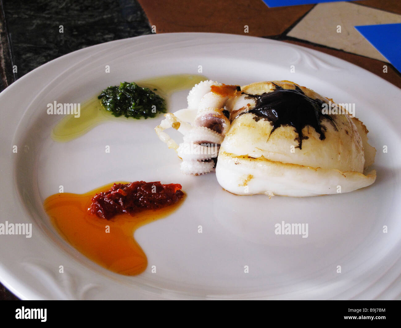 Small octopus with Mojo, sauces, La Gomera, Canaries, Canary Islands, Spain, Europe Stock Photo