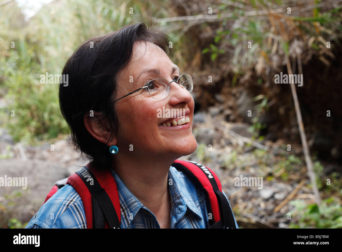 Woman smiling whilst on a hike, La Gomera, Canaries, Canary Islands, Spain, Europe Stock Photo