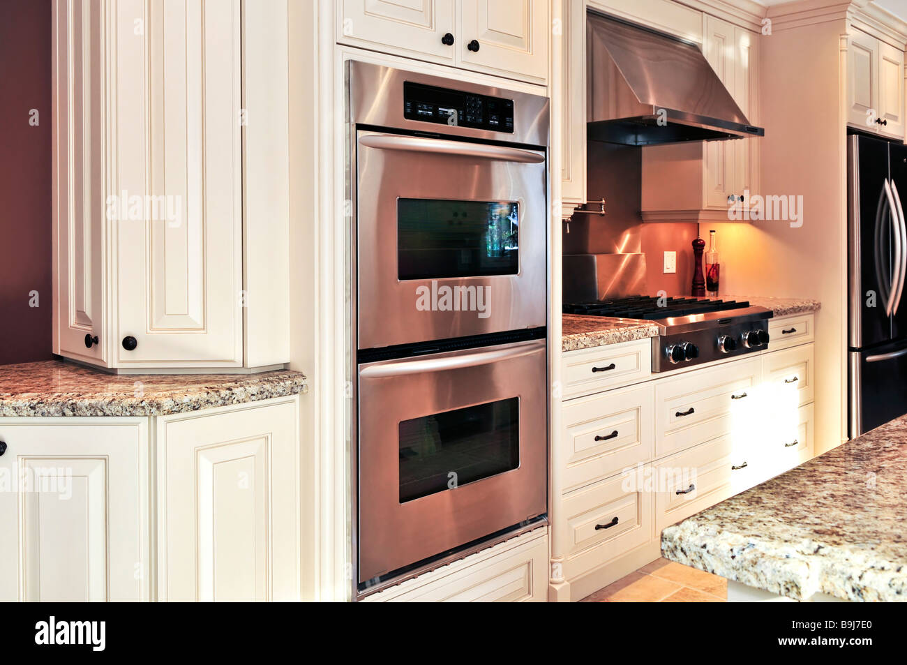 Interior of modern luxury kitchen with stainless steel appliances Stock Photo