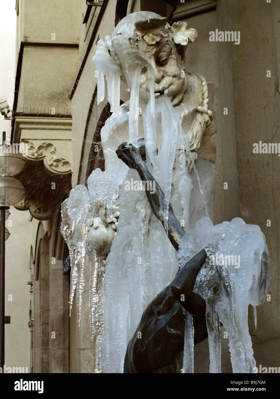 Frozen over Brunnenbuberl Fountain in Neuhauser Street, Munich, Bavaria, Germany, Europe Stock Photo