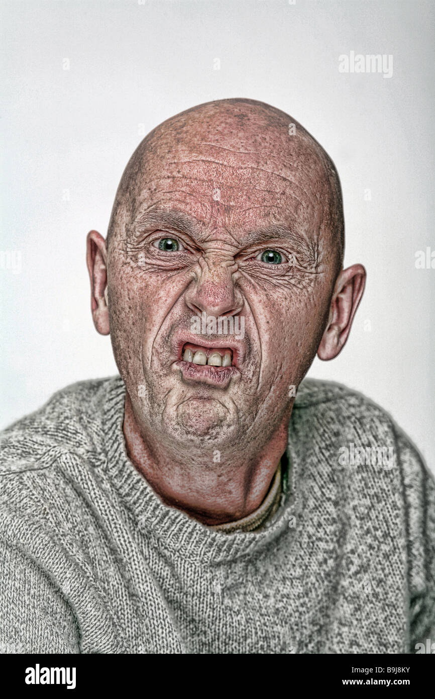 manipulated images of a middle-aged bald man being angry aggressive, and scary Stock Photo