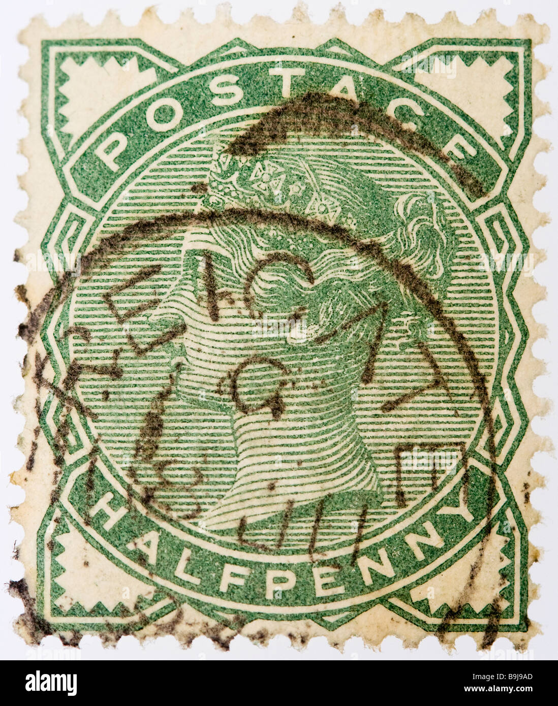 Close up of ½d, half penny green Victorian British Postal stamp on white background 1880 SG 164 used. Round postmarked Reigate. Stock Photo