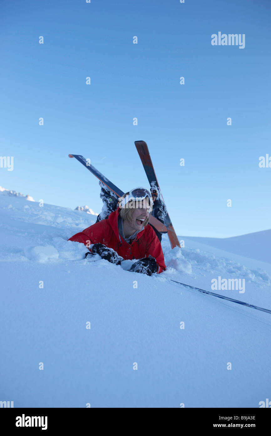 Female skier fallen over Stock Photo