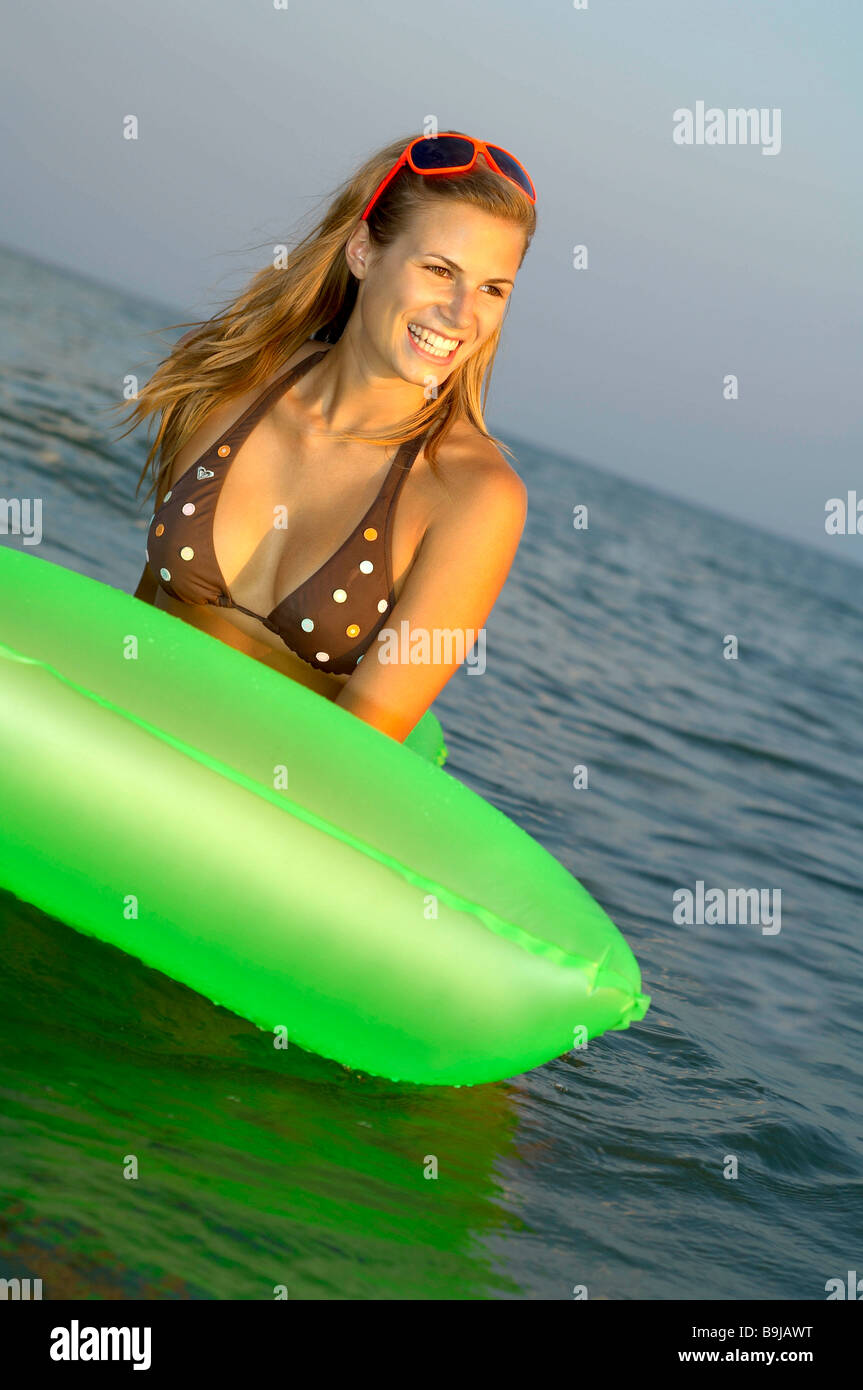 Young woman at the beach Stock Photo