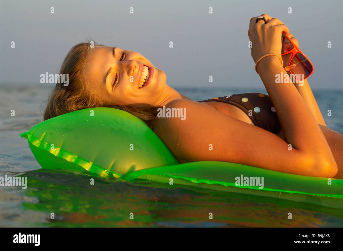 Young woman at the beach Stock Photo