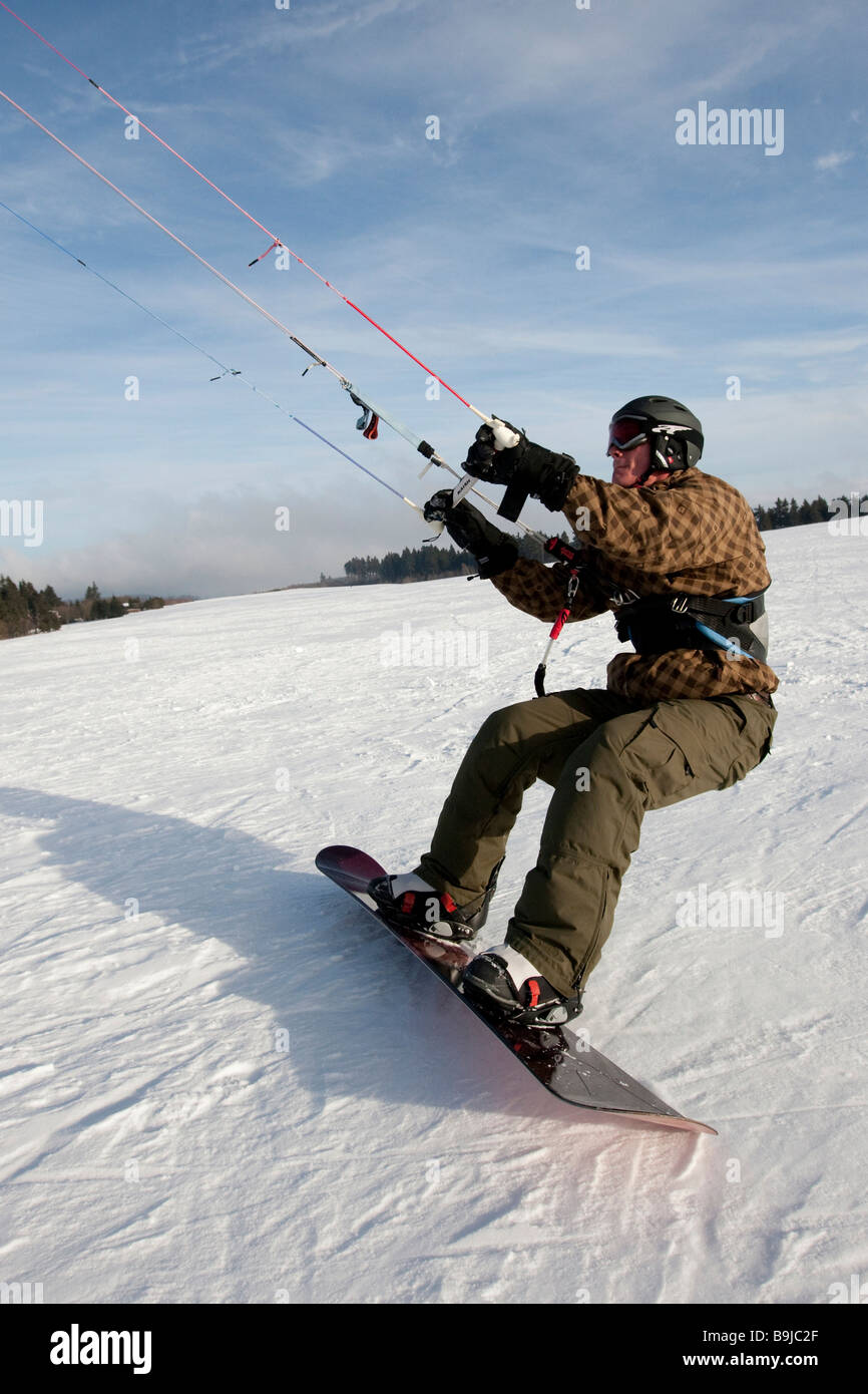 Snowkiter snowkiting, Wasserkuppe plateau, Rhoen mountains, Hesse, Germany, Europe Stock Photo