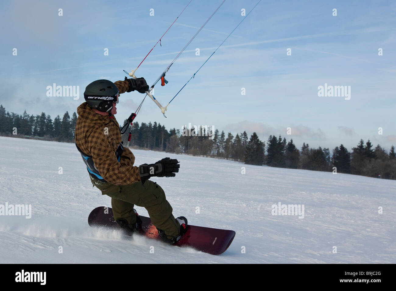 Snowkiter snowkiting, Wasserkuppe plateau, Rhoen mountains, Hesse, Germany, Europe Stock Photo