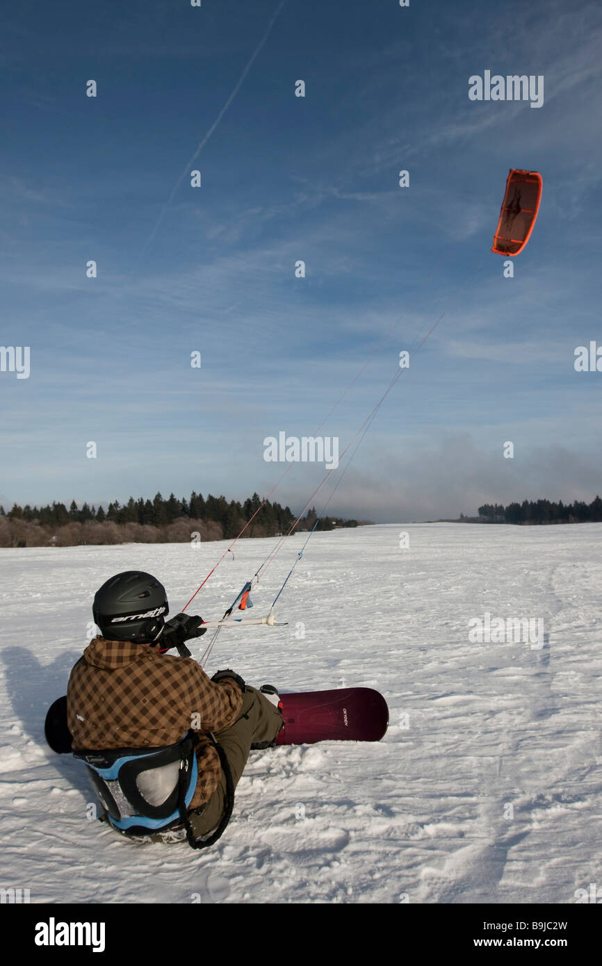 Snowkiter preparing to start snowkiting, Wasserkuppe plateau, Rhoen mountains, Hesse, Germany, Europe Stock Photo