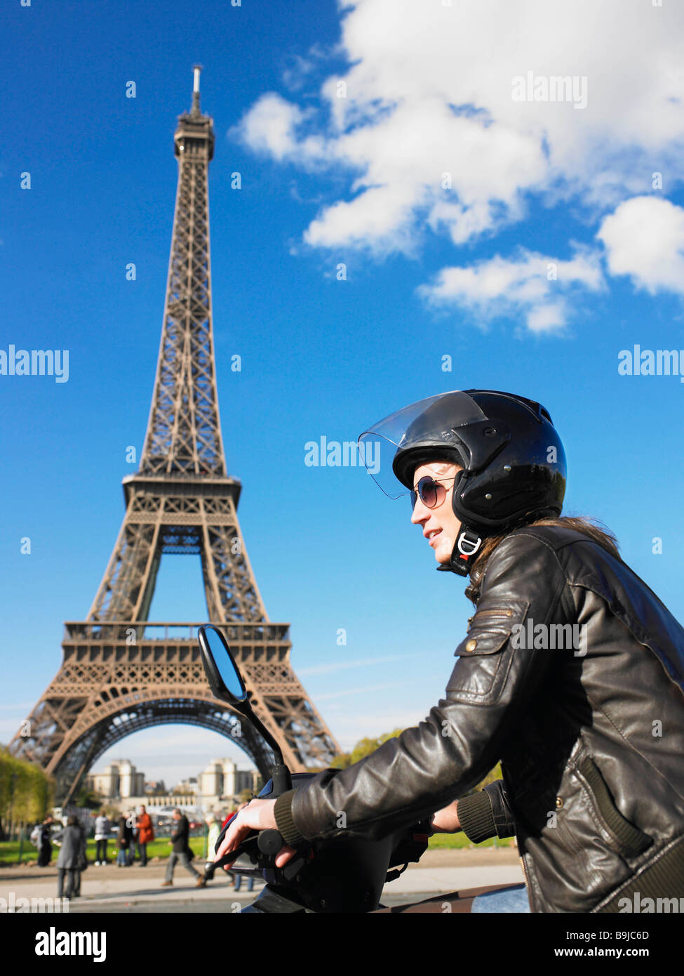 Woman on moped in Paris Stock Photo Alamy