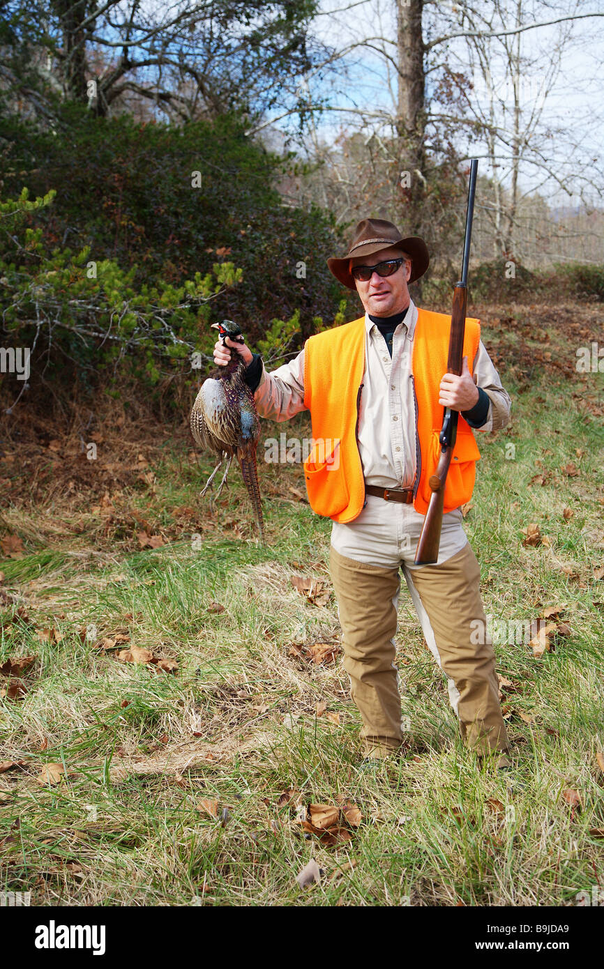 Hunter David White Canton GA holding a harvested ring necked pheasant Stock Photo