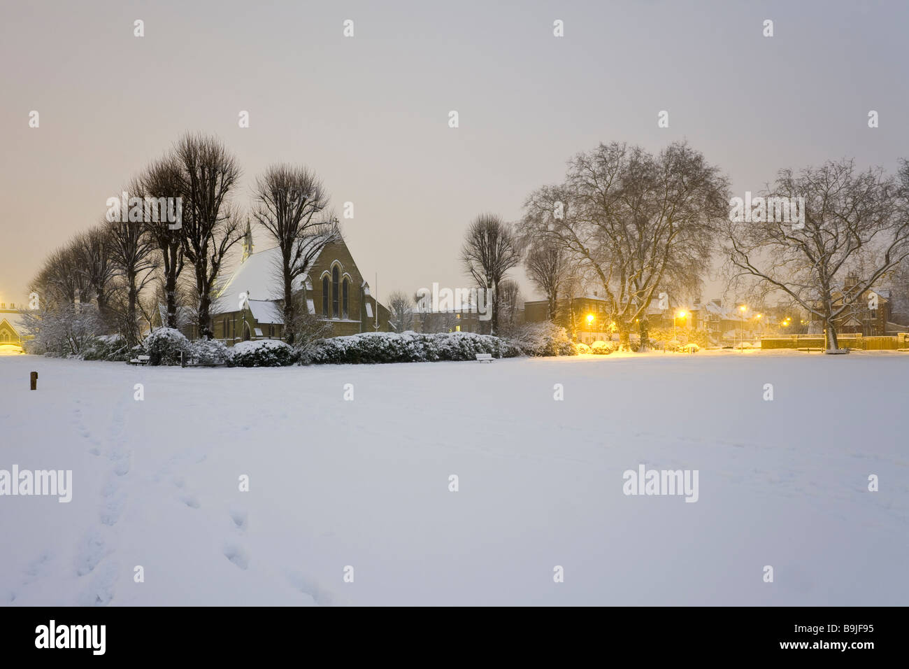 Putney Common and All Saints' church, Putney, South west London, at dawn after a heavy snowfall . Stock Photo