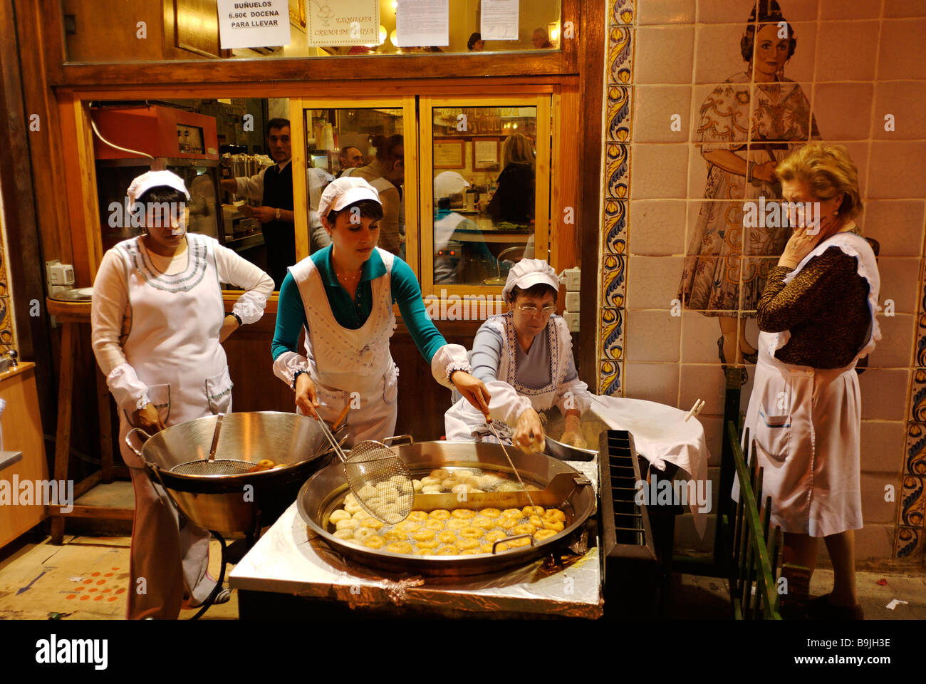 People Cooking Spanish Donuts Bunuelos Traditionally Eaten During Las Fallas Festival With Hot Chocolate Valencia Spain Stock Photo Alamy