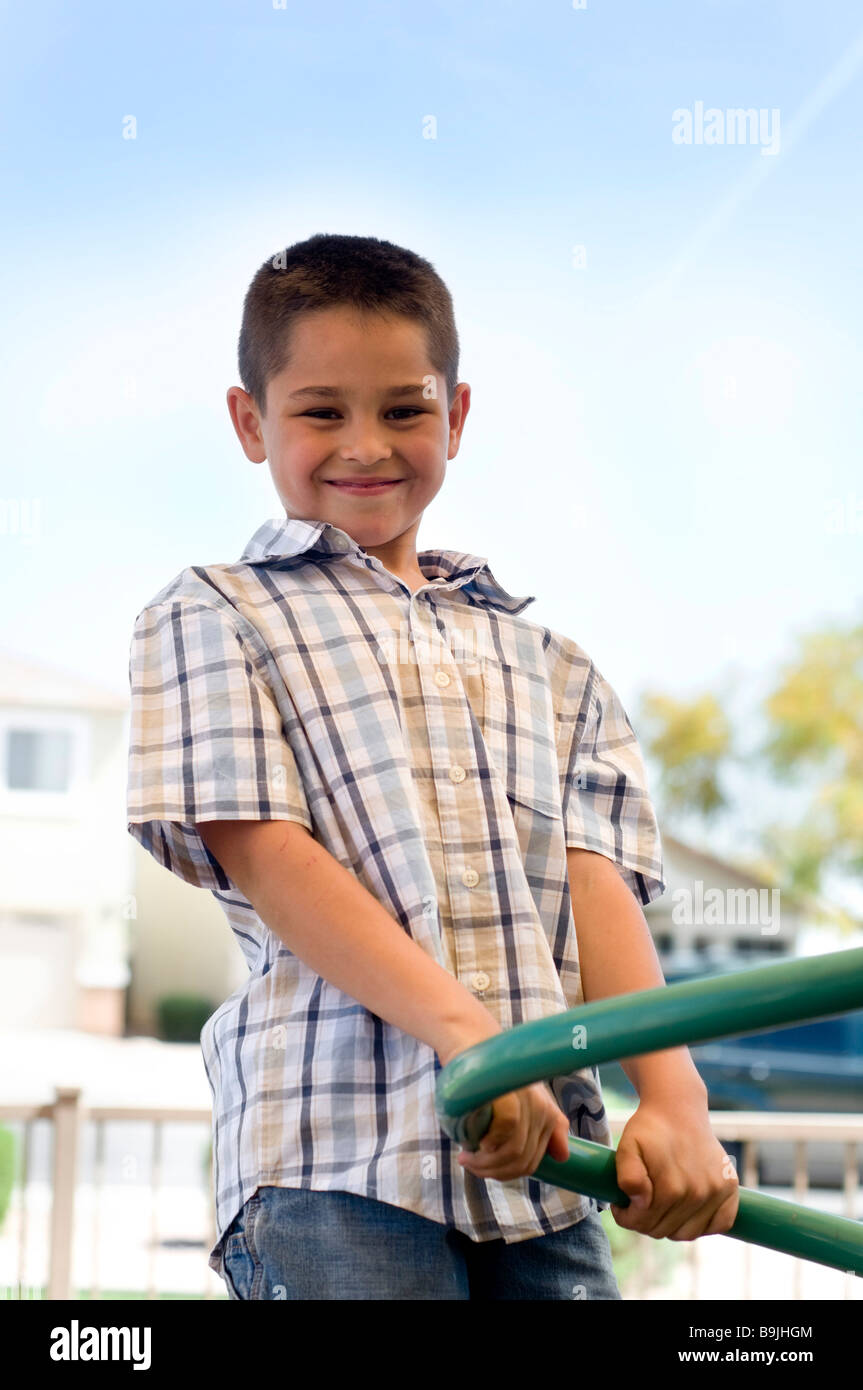 Portrait Of A Happy Smiling Little Boy Playing Outside In Park Stock portrait-of-a-happy-smiling-little-boy-playing-outside-in-park-stock