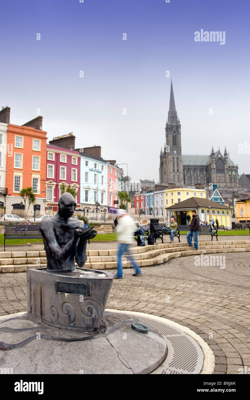 The navigator statue and Cobh waterfront with St. Colman's Cathedral in the background, County