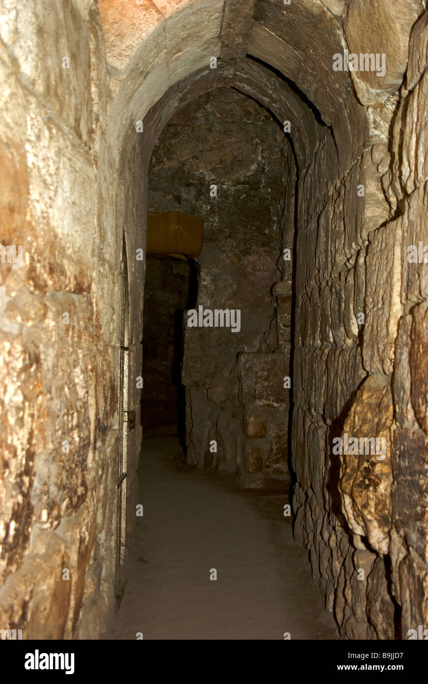 Labyrinth of narrow and low tunnels in archaeological excavation below
