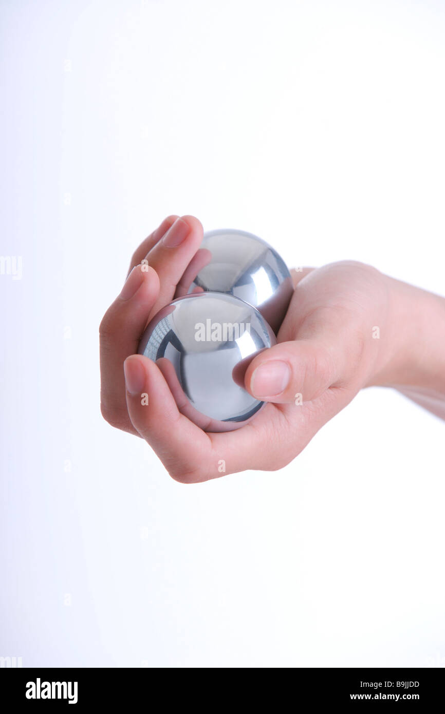 Hand with two metal balls Stock Photo Alamy