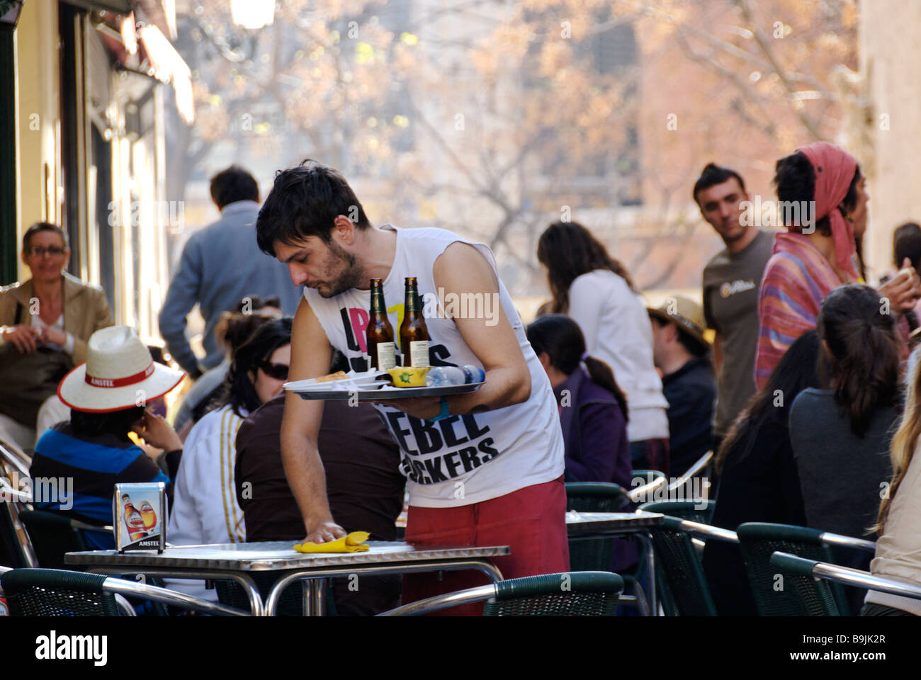 Cafe waiter in busy bar in El Carmen during las Fallas festival historic city centre of Valencia Spain Stock Photo
