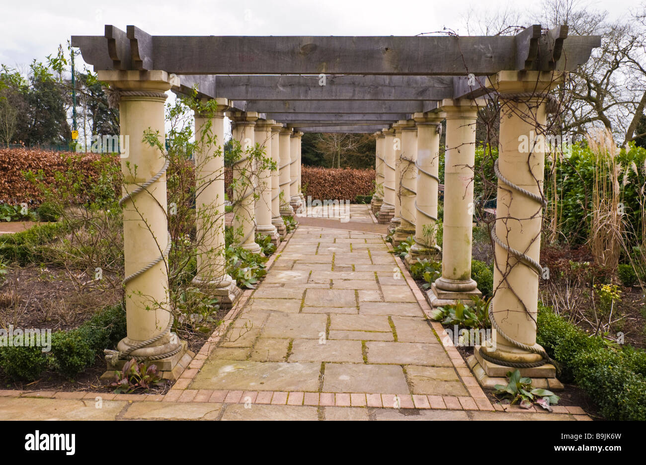 Formal garden with pergola walkway in Belle Vue park a Victorian public park in Newport South Wales UK Stock Photo