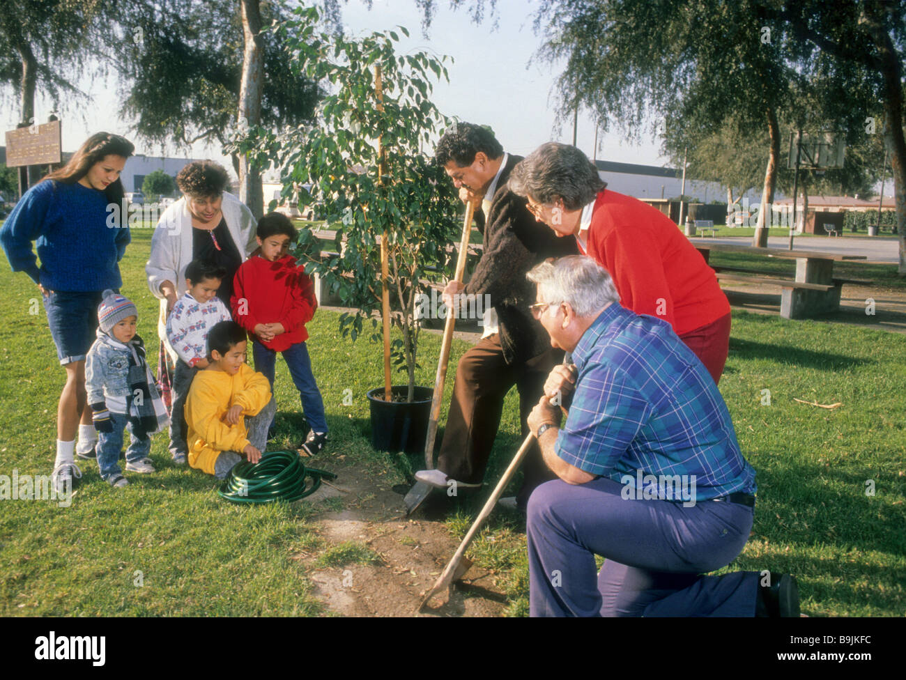 Family plant tree memory park arbor day dig garden grow father mother