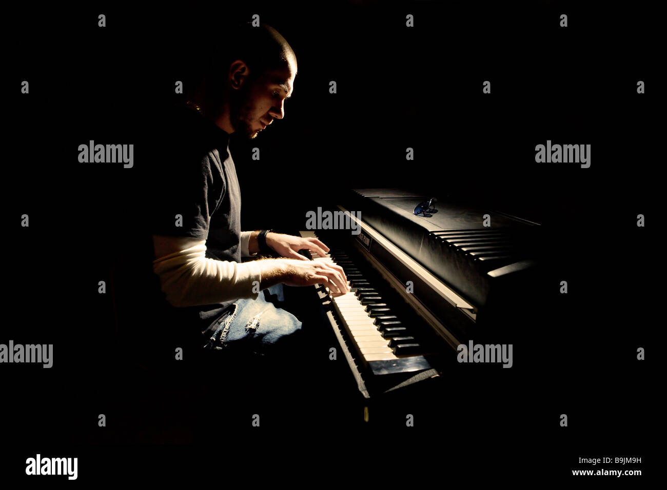 Pianist playing on electric piano Stock Photo
