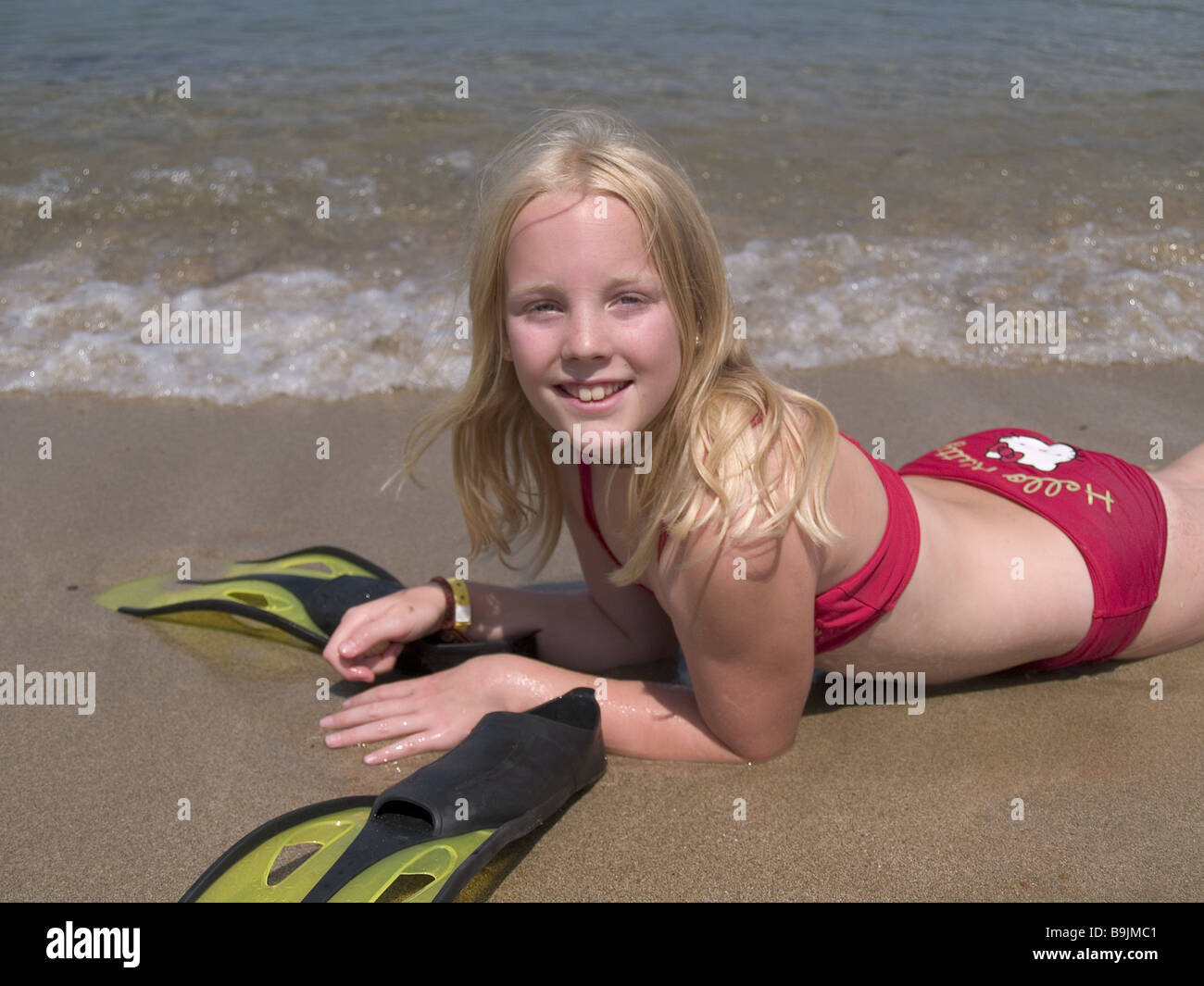 girl lying beach bikini smiling fins series vacation vacation child