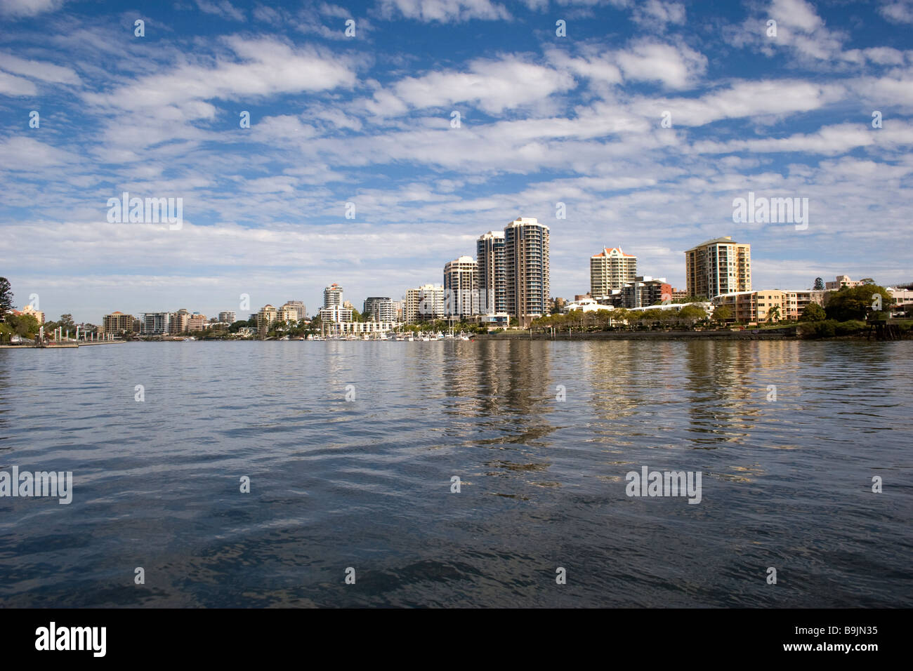 Buildings on the Brisbane River in the Suburbs in this Capitol City of Queensland show the skyline Stock Photo