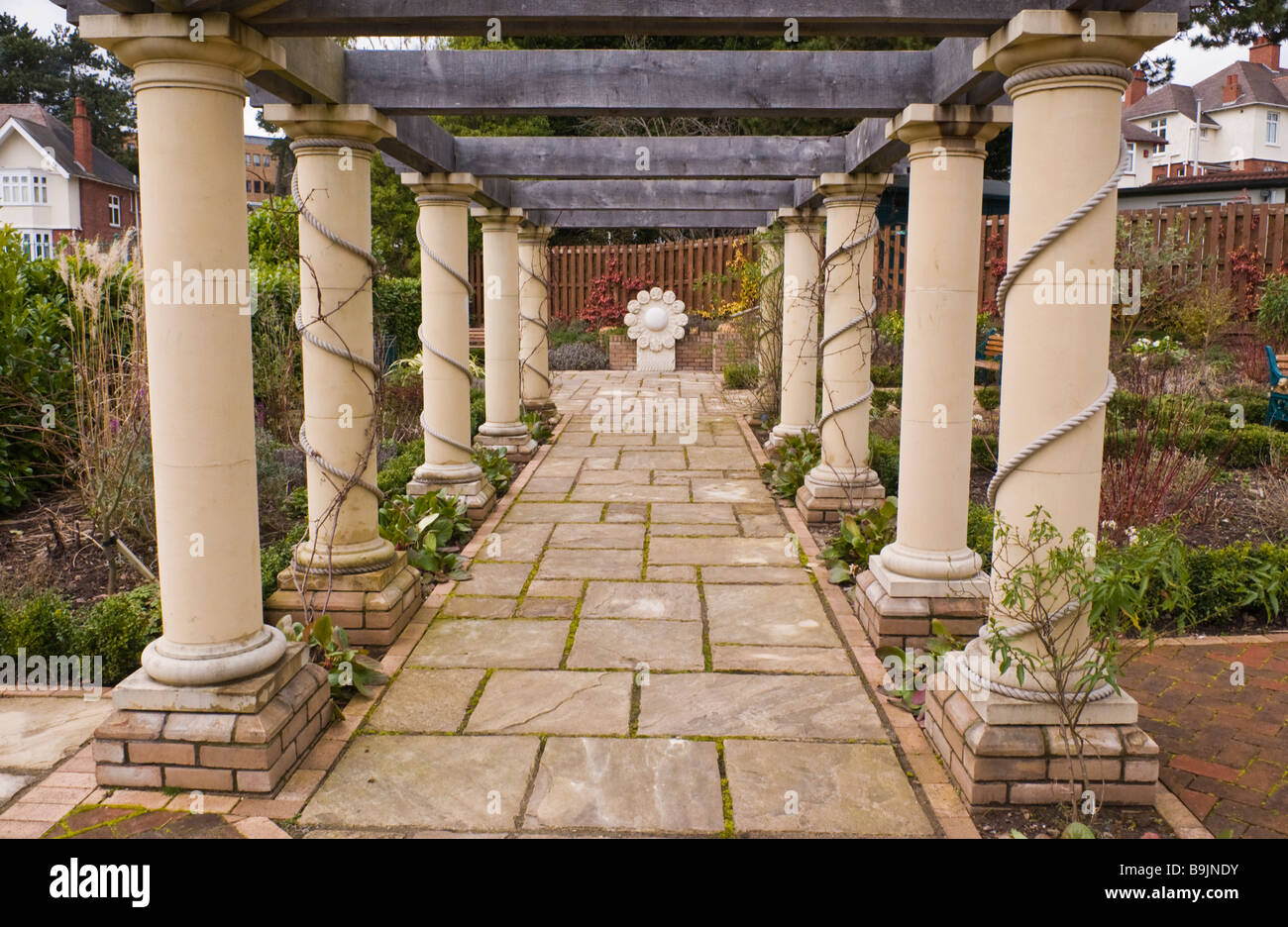 Pergola walkway with focal point in formal garden at Belle Vue park a Victorian public park in Newport South Wales UK Stock Photo