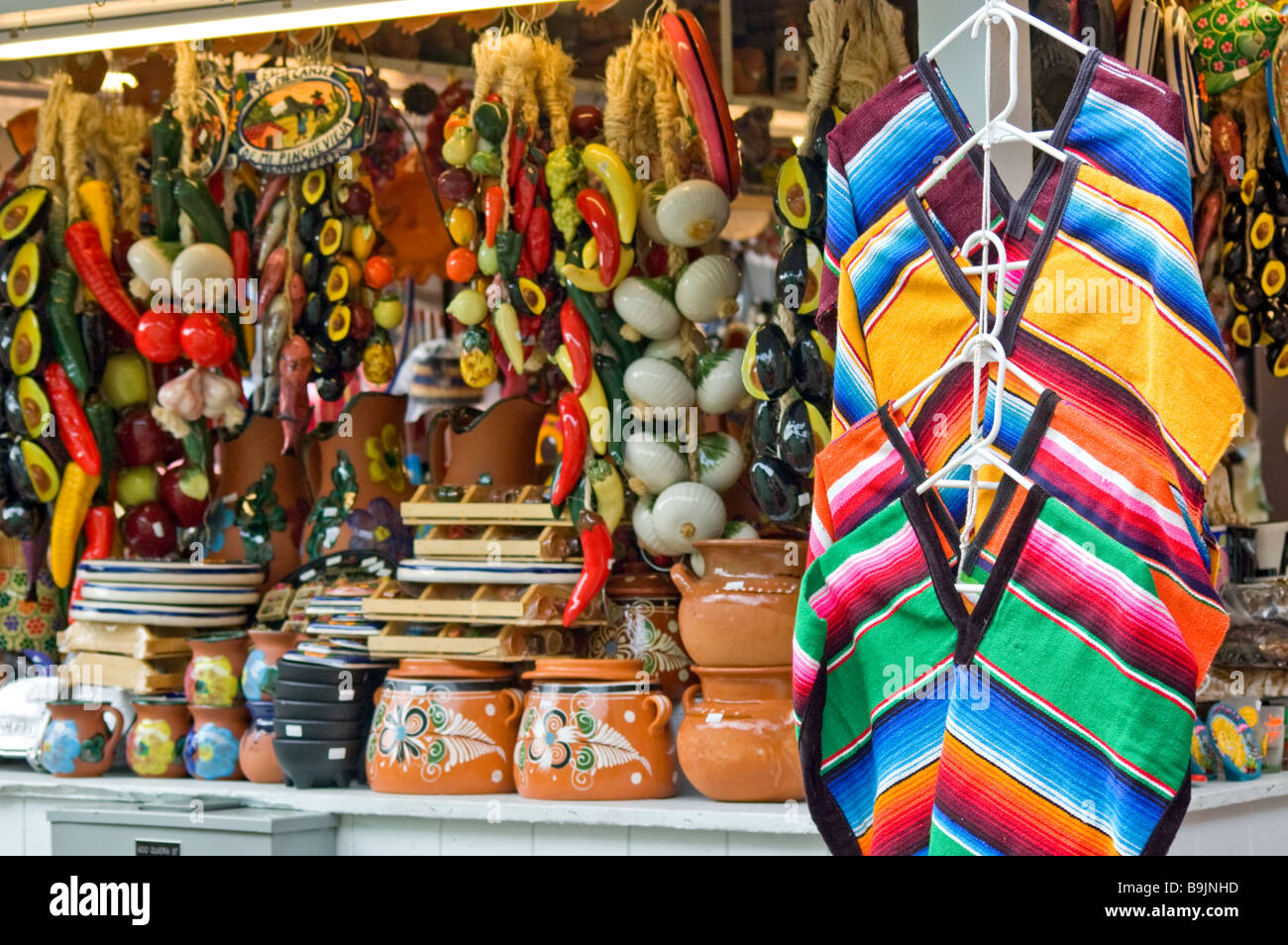 A variety of items being sold by a merchant on Olvera Street, Los Angeles, California Stock Photo