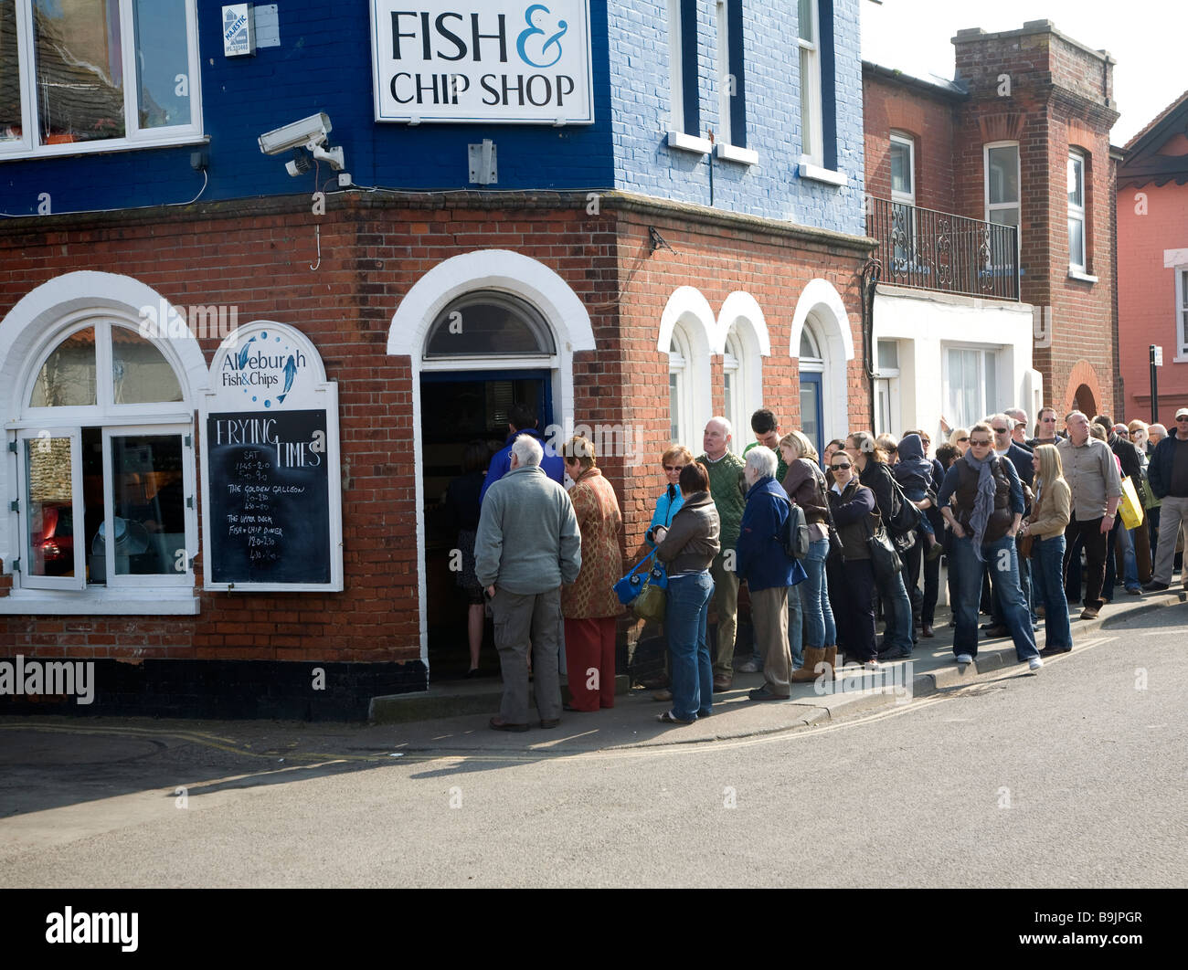 Queue outside famous fish and chip shop, Aldeburgh, Suffolk, England Stock Photo