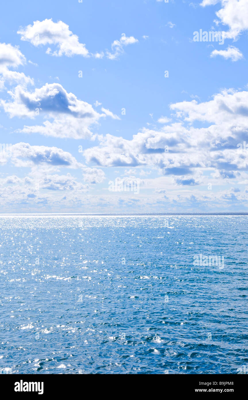 Blue ocean water and sunny sky background Stock Photo - Alamy