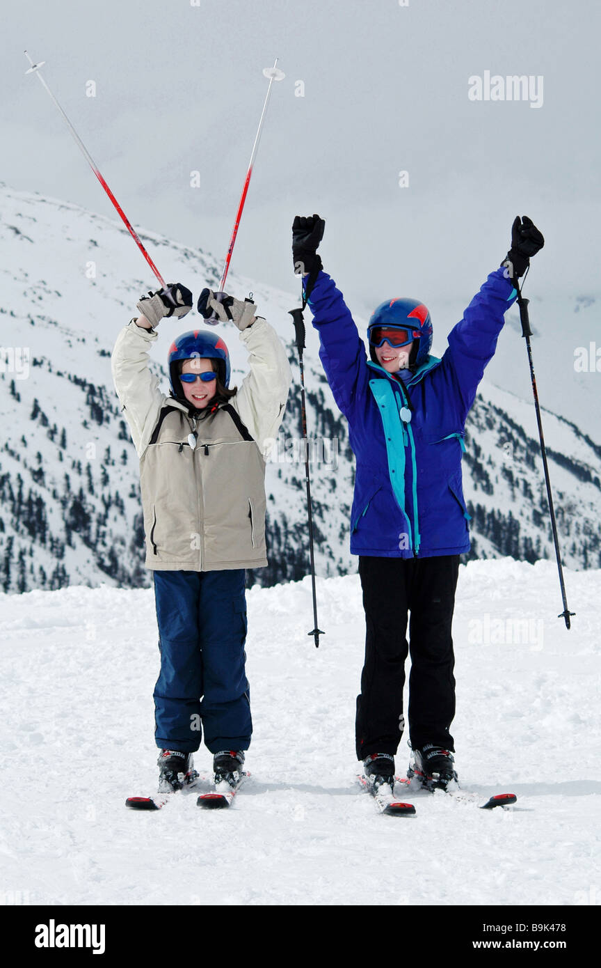 portrait of two children on skis Stock Photo Alamy