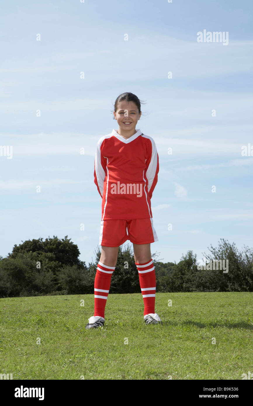 Female footballer standing Stock Photo