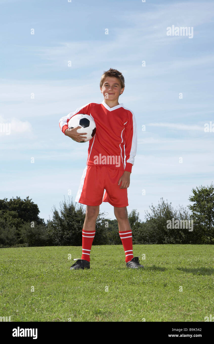 Young Male footballer with a ball Stock Photo