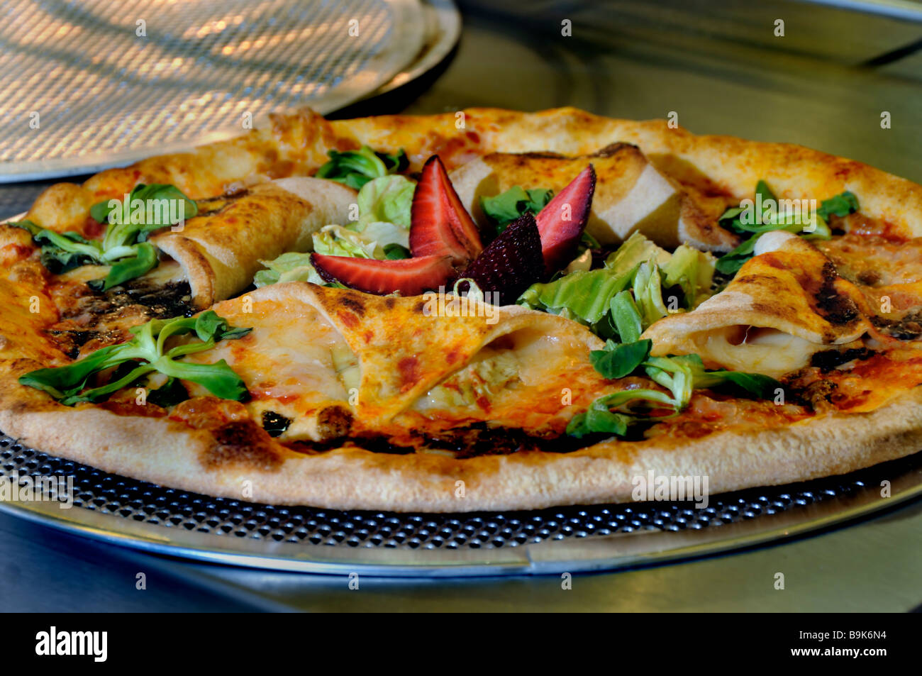 Food on a Plate"l Food Trade Show Italian Pizza with Fruit and Vegetables  at "Moretti Forni" Company Pizzeria France, table Stock Photo - Alamy
