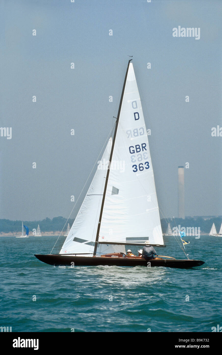 A Dragon class one design sailing dinghy off Cowes Isle of Wight
