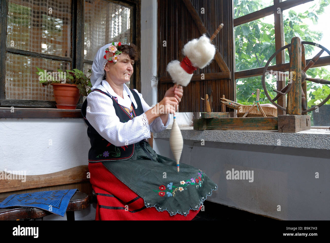 Bulgaria, Black Sea region, Bata, cotton spinner in traditional outfit Stock Photo