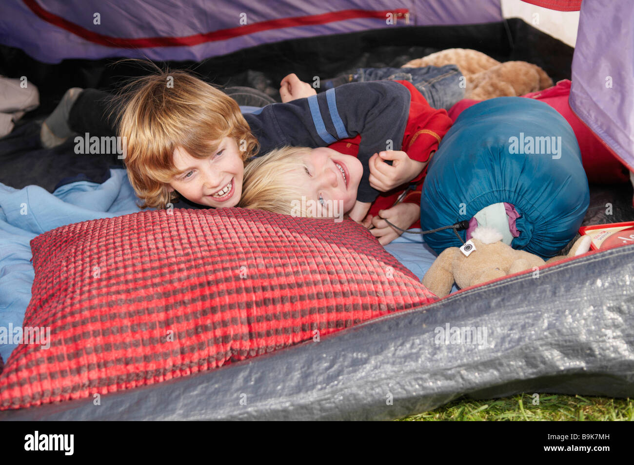 Boys playing of tent Stock Photo Alamy