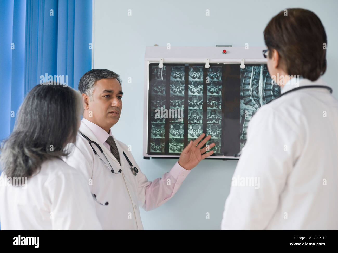 Medical team examining an x ray report hi-res stock photography and ...