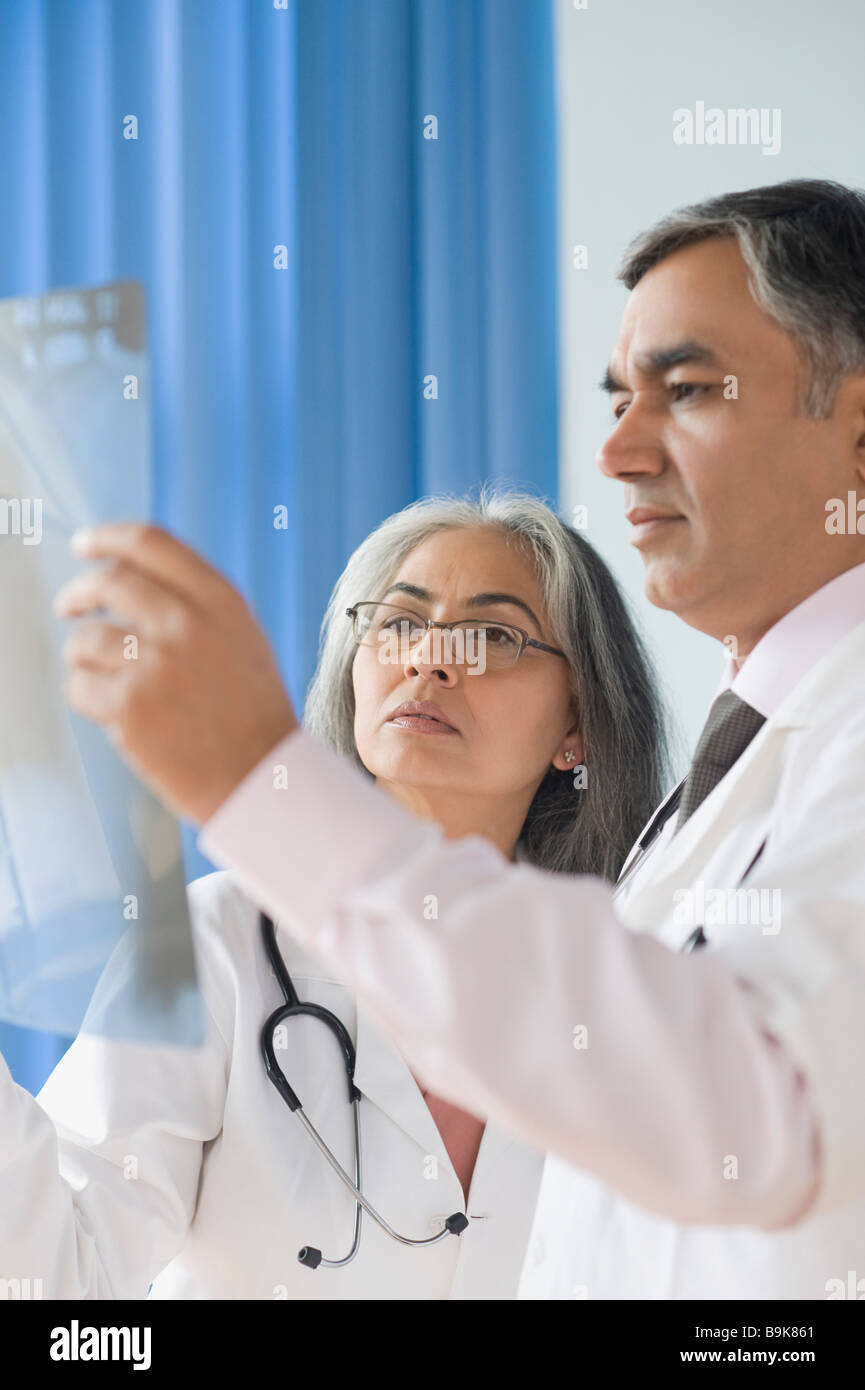 Two doctors examining an x-ray report Stock Photo