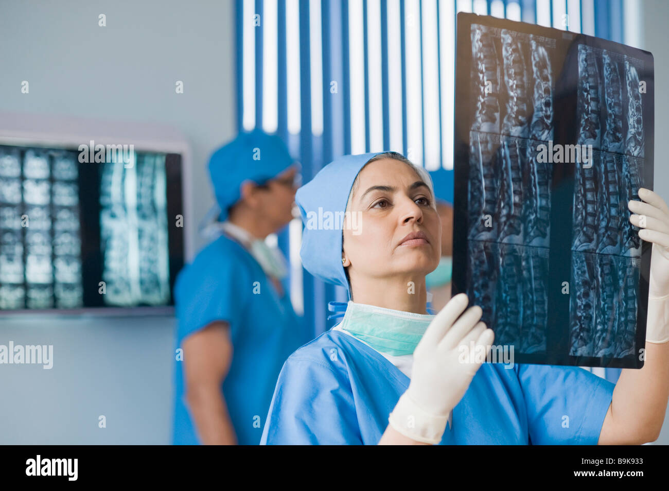 Female surgeon examining an x-ray report Stock Photo - Alamy