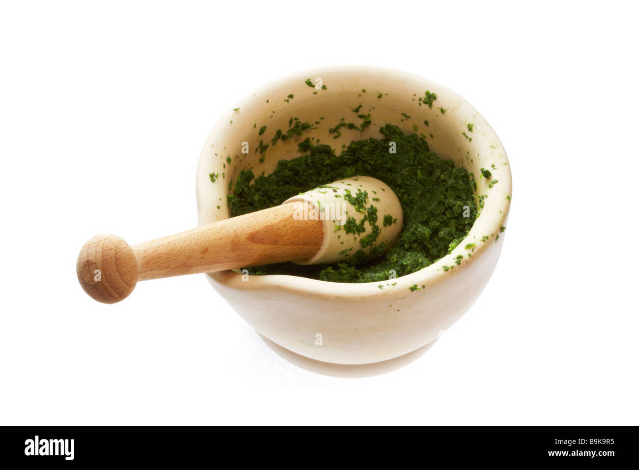 Green Pesto made in pestle and mortar Stock Photo Alamy