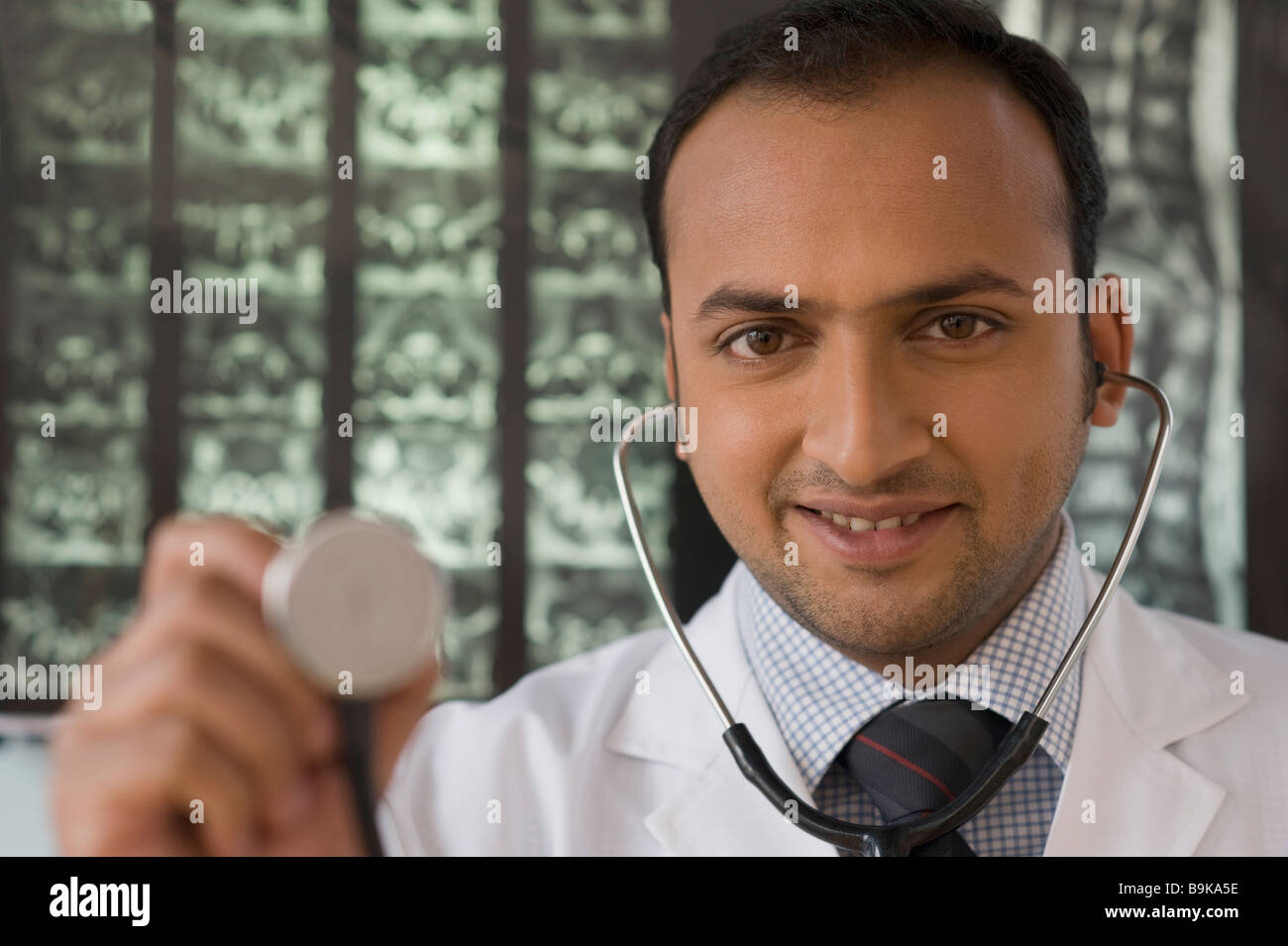 Portrait of a doctor holding a stethoscope Stock Photo - Alamy