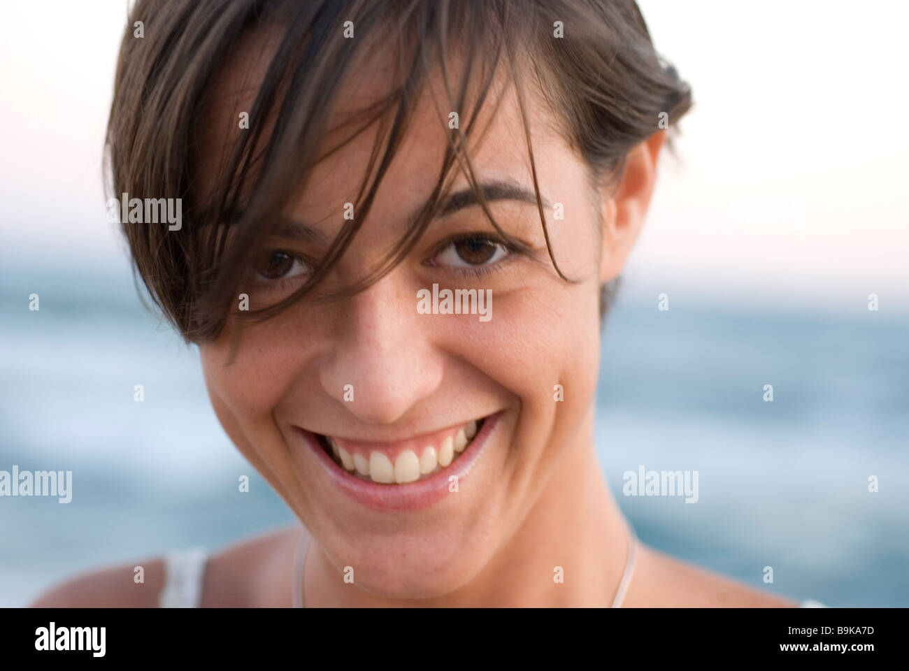 portrait of brown girl smiling at camera Stock Photo - Alamy
